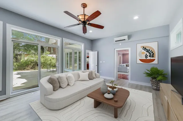 a living room with furniture and a large window