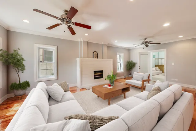 a living room with furniture and a fireplace