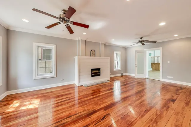 a view of livingroom with hardwood floor and a ceiling fan