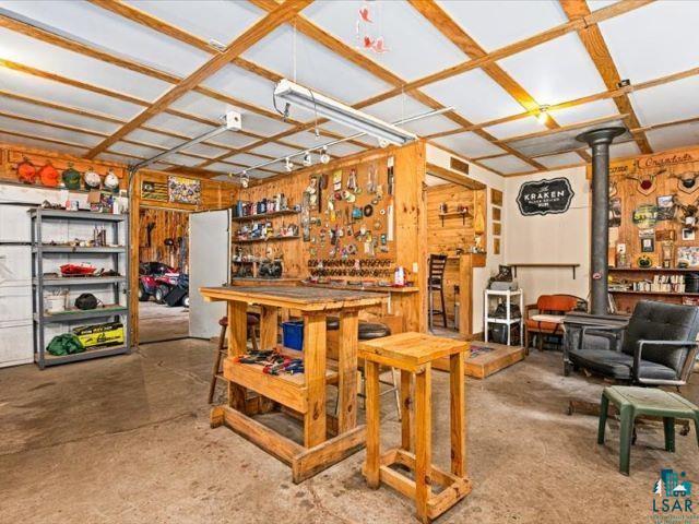 3616 Lavaque Road Hermantown, MN 55811 - Photo 27 of 43 Versatile bonus space featuring wood plank wall finishes, concrete flooring, and an exposed wood beam ceiling