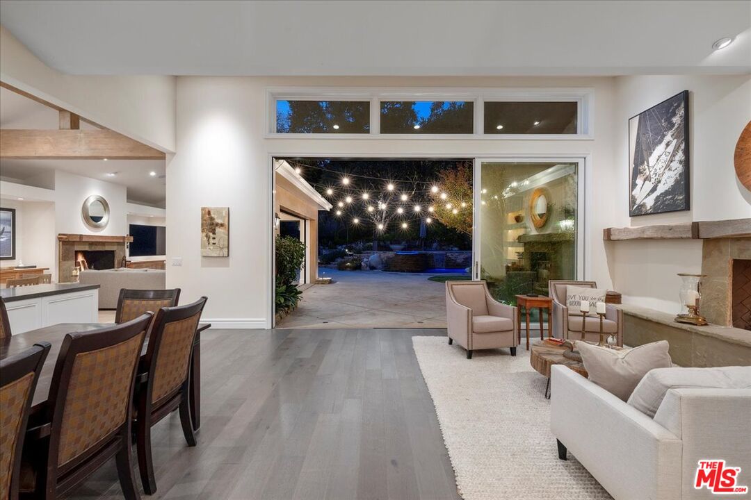 809 Leonard Road Los Angeles, CA 90049 - Photo 13 of 72 a living room with furniture and a fireplace