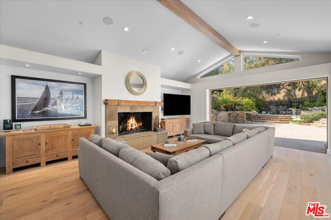 809 Leonard Road Los Angeles, CA 90049 - Photo 19 of 72 a living room with furniture fireplace and window
