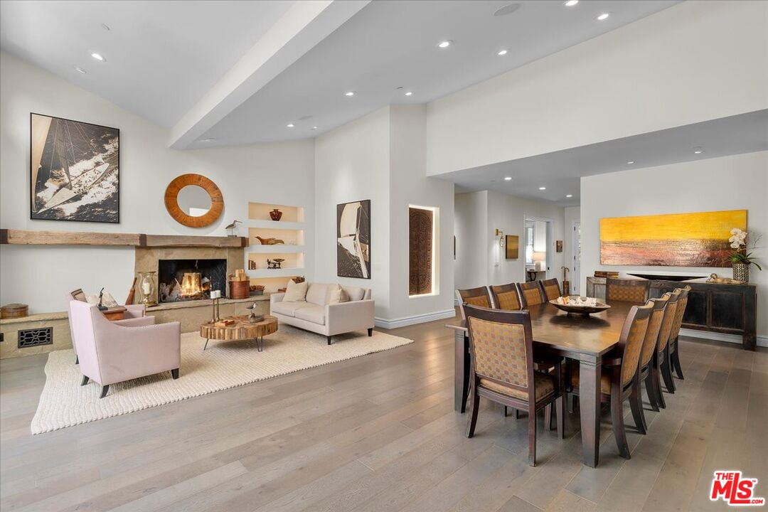 809 Leonard Road Los Angeles, CA 90049 - Photo 24 of 72 a view of a dining room with furniture window and wooden floor