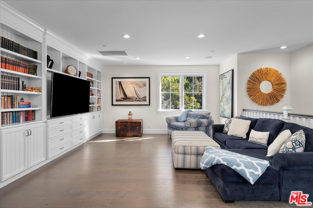 809 Leonard Road Los Angeles, CA 90049 - Photo 49 of 72 a living room with furniture and a flat screen tv