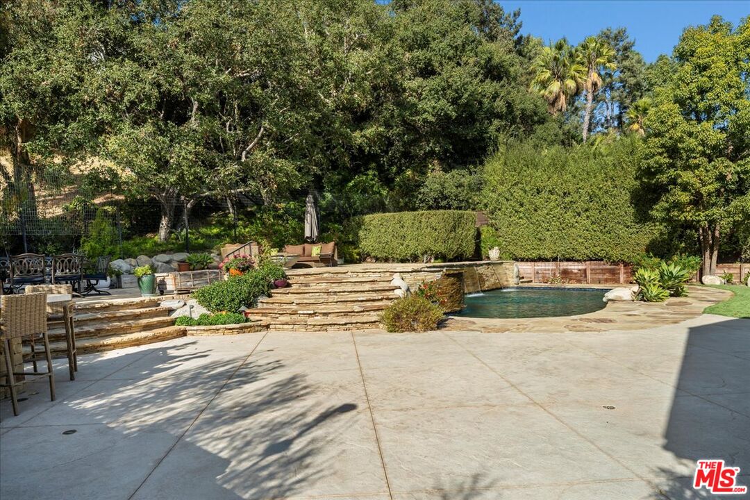 809 Leonard Road Los Angeles, CA 90049 - Photo 70 of 72 a view of a swimming pool with a patio
