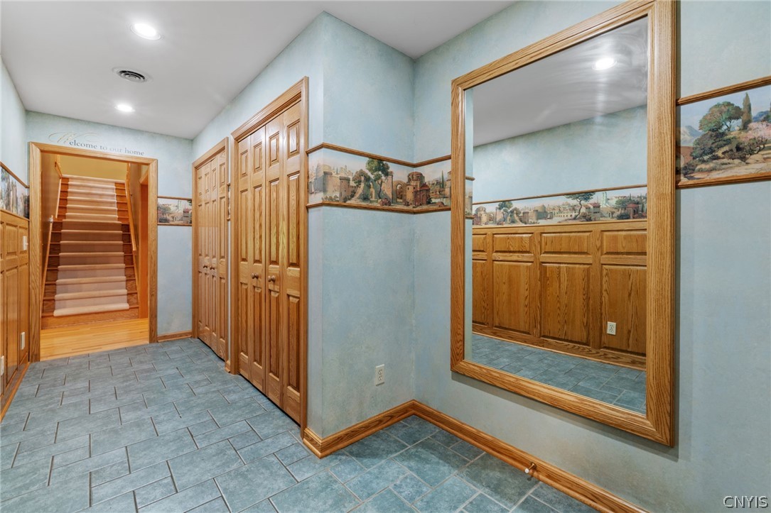 1103 Rail Fence Road Camillus, NY 13031 - Photo 27 of 50 Hallway from the garage with tile flooring, much storage and a large walk in pantry
