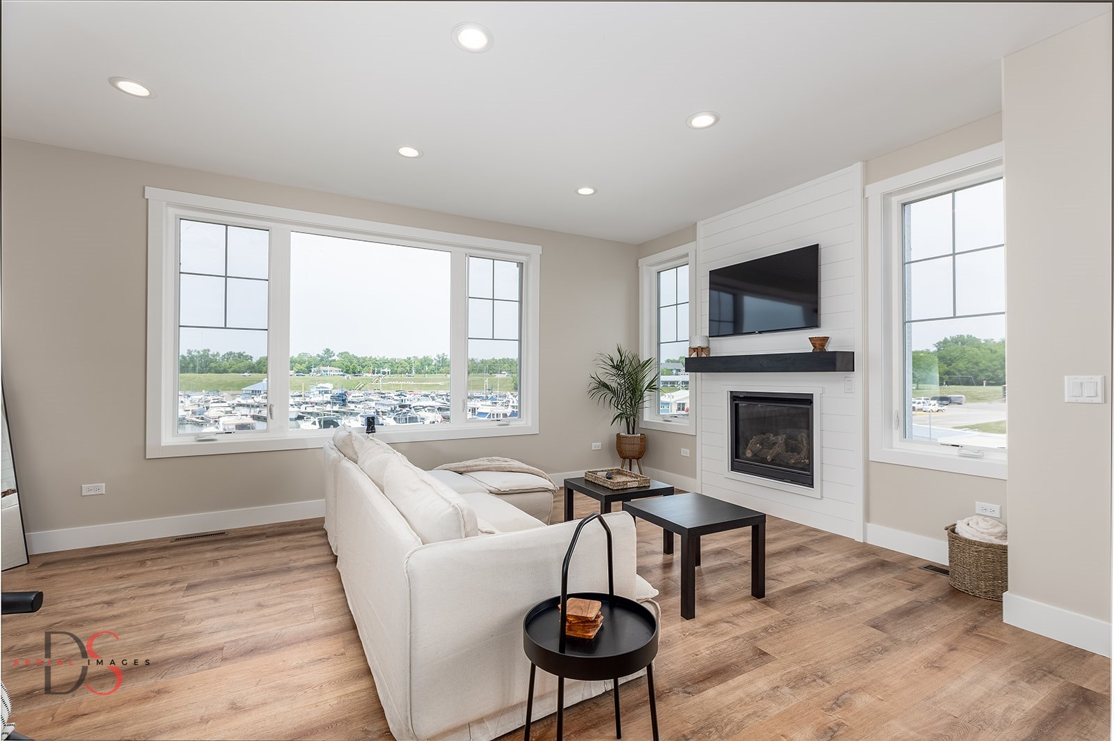 208 Leeward Way Ottawa, IL 61350 - Photo 11 of 28 a living room with furniture a fireplace and a flat screen tv