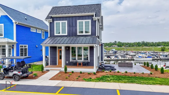 a front view of a house with garden and porch