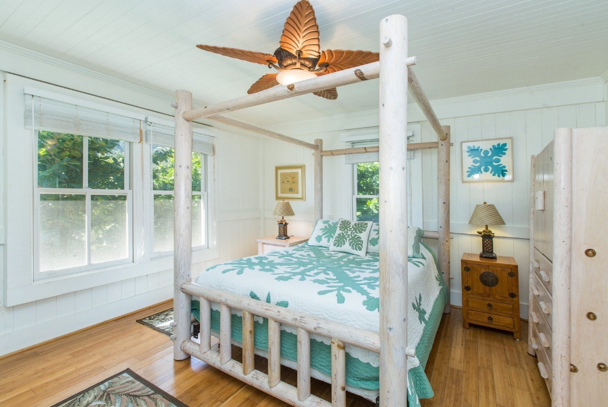 7206 Alamoo Road Hanalei, HI 96714 - Photo 11 of 17 a bedroom with furniture and a window