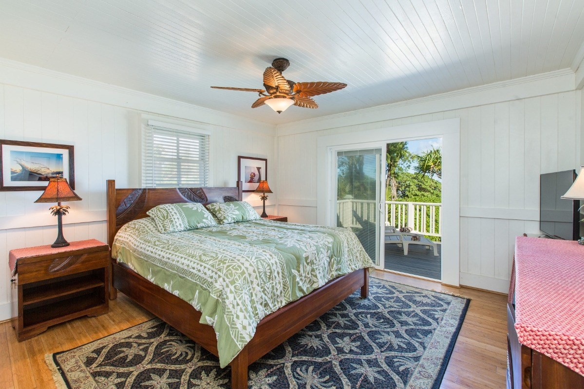 7206 Alamoo Road Hanalei, HI 96714 - Photo 10 of 17 a bedroom with a bed and wooden floor