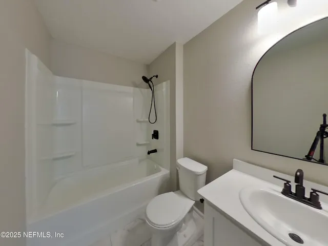 a bathroom with a sink a toilet and a bathtub