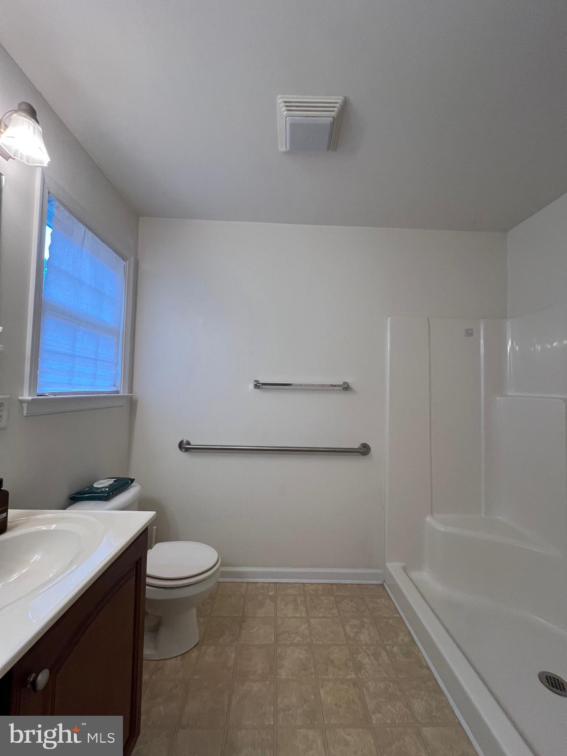 30471 Manor Drive Princess Anne, MD 21853 - Photo 18 of 23 a bathroom with a sink a toilet and bathtub