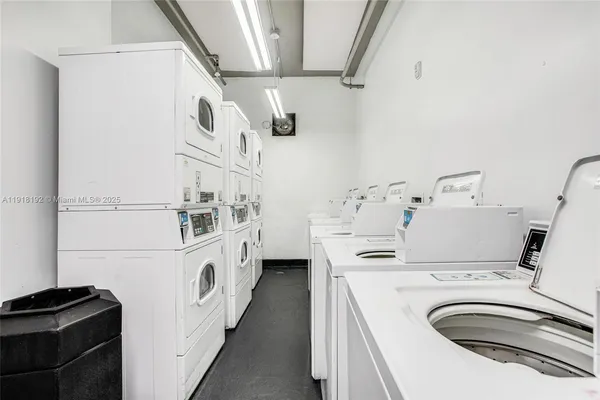 a kitchen with stainless steel appliances a sink and a refrigerator