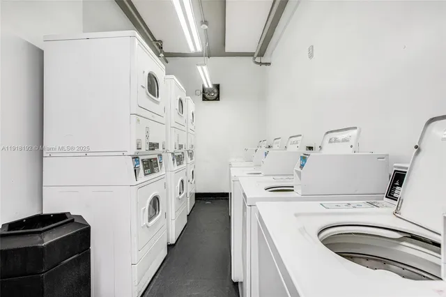 a kitchen with stainless steel appliances a sink and a refrigerator