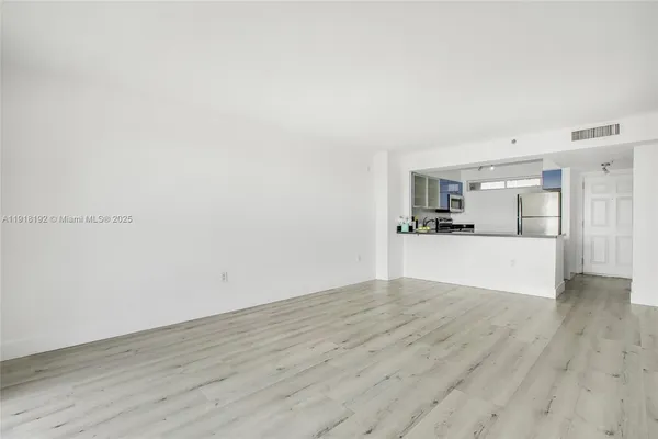 a view of kitchen with wooden floor