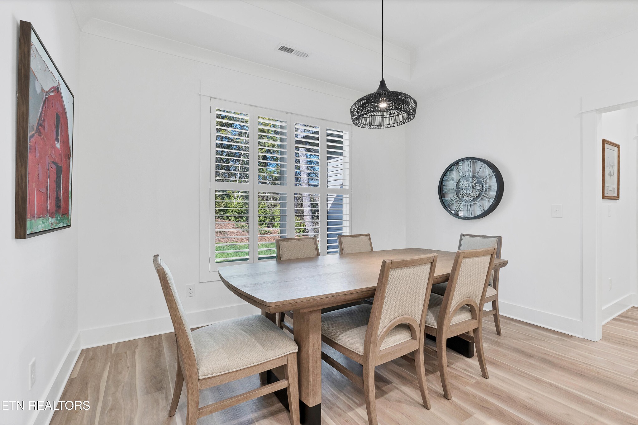 374 Mingo Way Loudon, TN 37774 - Photo 11 of 51 a view of a dining room with furniture clock and wooden floor