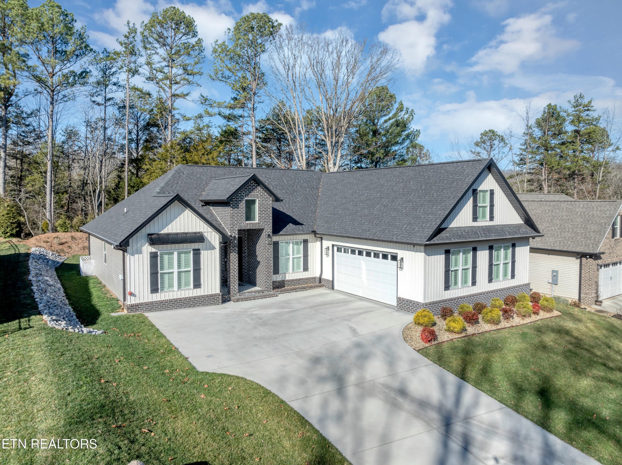 374 Mingo Way Loudon, TN 37774 - Photo 3 of 51 front view of a house with a yard