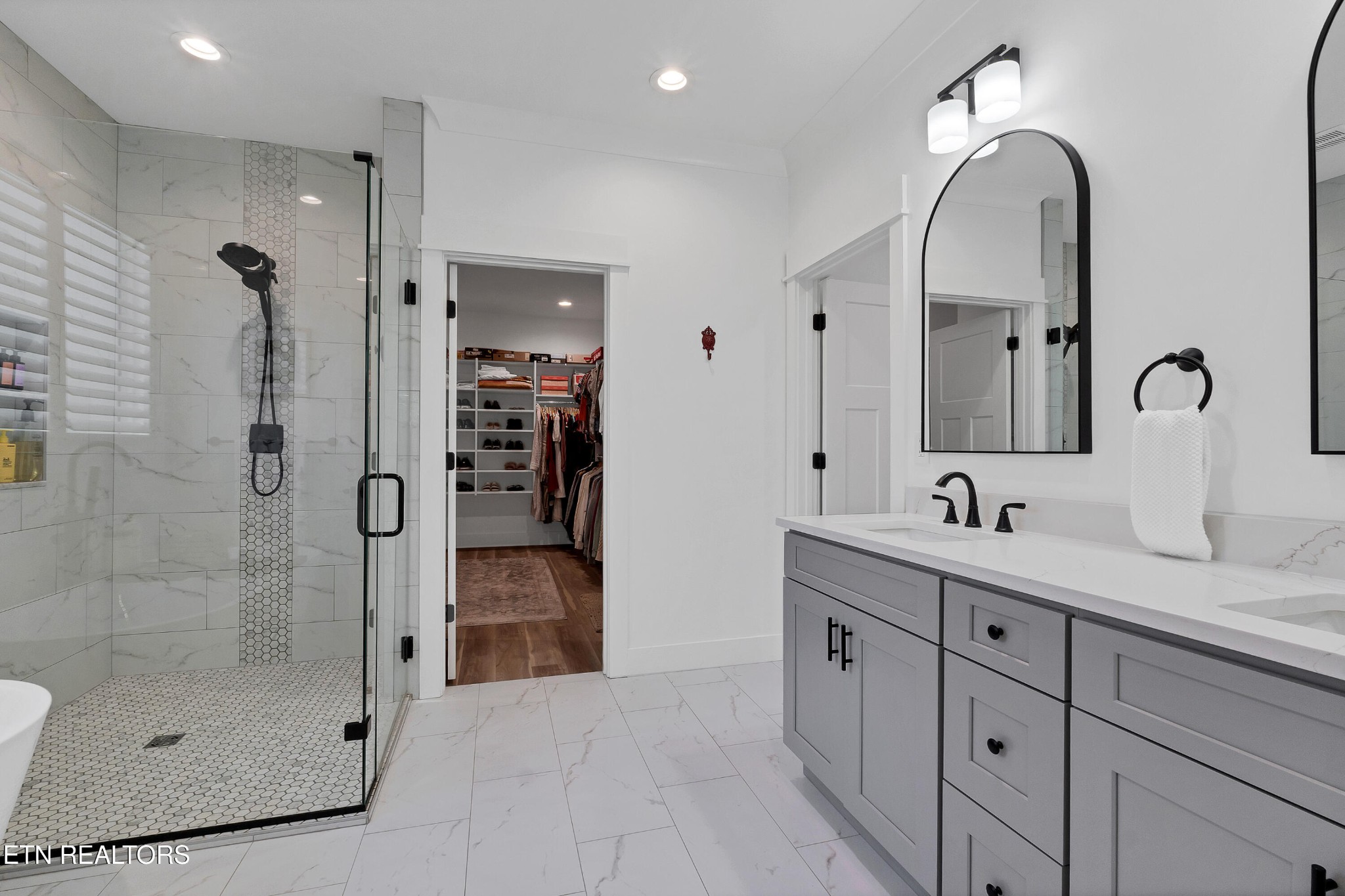 374 Mingo Way Loudon, TN 37774 - Photo 36 of 51 a bathroom with a double vanity sink and a mirror