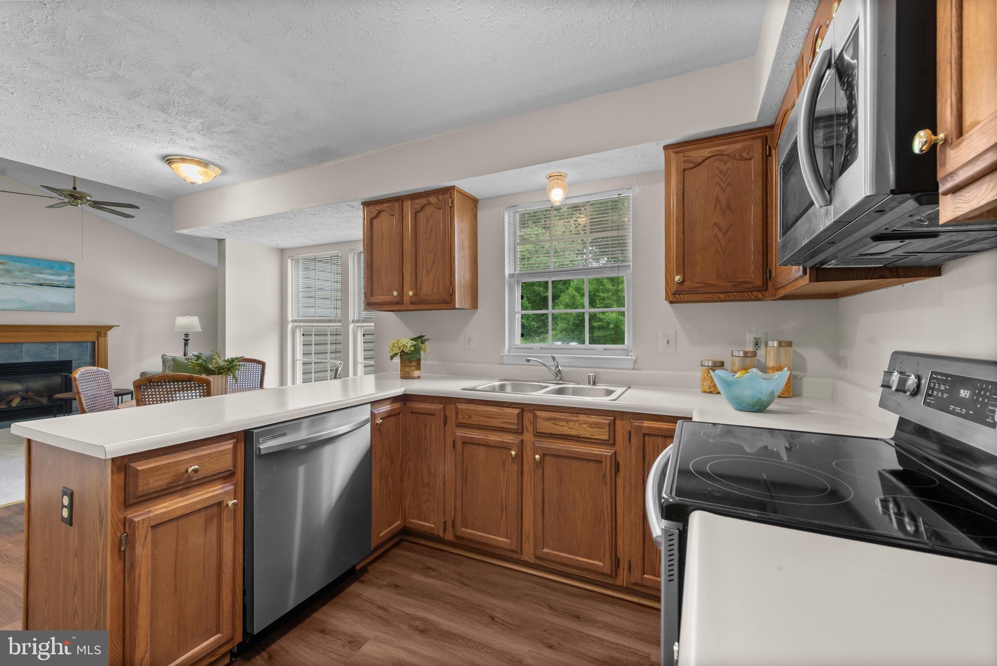 3107 Pouska Road Abingdon, MD 21009 - Photo 11 of 38 a kitchen with a sink a stove and cabinets