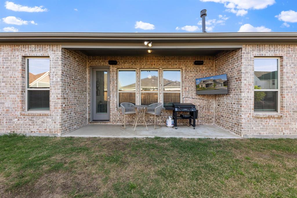 8808 Royal Star Road Rowlett, TX 75089 - Photo 36 of 40 a front view of a house with outdoor seating yard