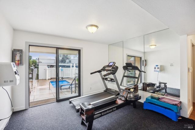 a view of a house with swimming pool and sitting area