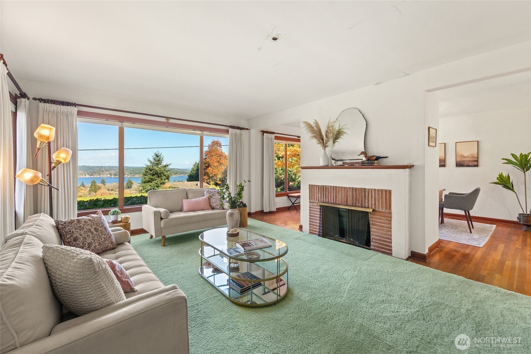 9619 Southwest 268th Street Vashon, WA 98070 - Photo 12 of 37 a living room with furniture and a fireplace