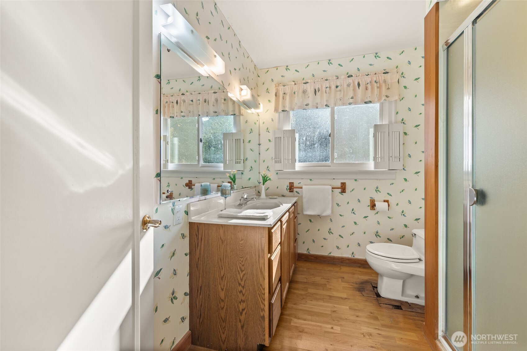 9619 Southwest 268th Street Vashon, WA 98070 - Photo 16 of 37 a bathroom with a sink toilet and shower