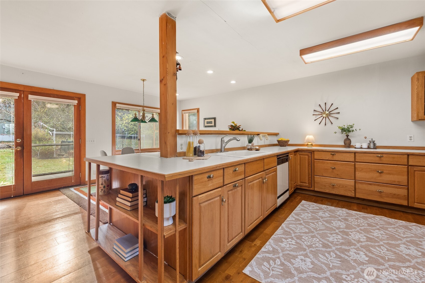 9619 Southwest 268th Street Vashon, WA 98070 - Photo 19 of 37 a kitchen with a wooden cabinets and sink