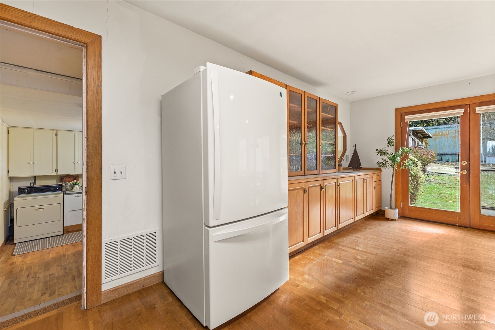 9619 Southwest 268th Street Vashon, WA 98070 - Photo 20 of 37 a view of a kitchen with a refrigerator and a sink