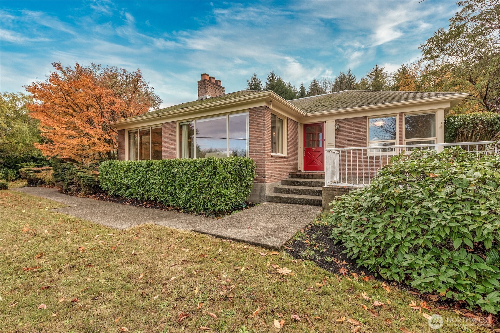 9619 Southwest 268th Street Vashon, WA 98070 - Photo 2 of 37 a front view of a house with large windows