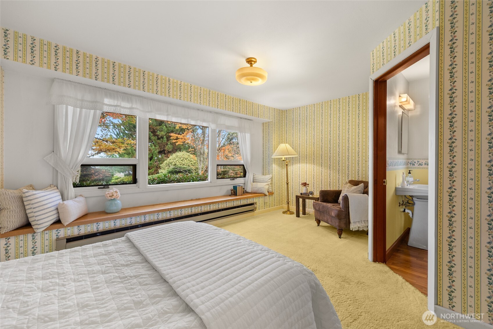 9619 Southwest 268th Street Vashon, WA 98070 - Photo 23 of 37 a bedroom with a bed and a large window with outer view