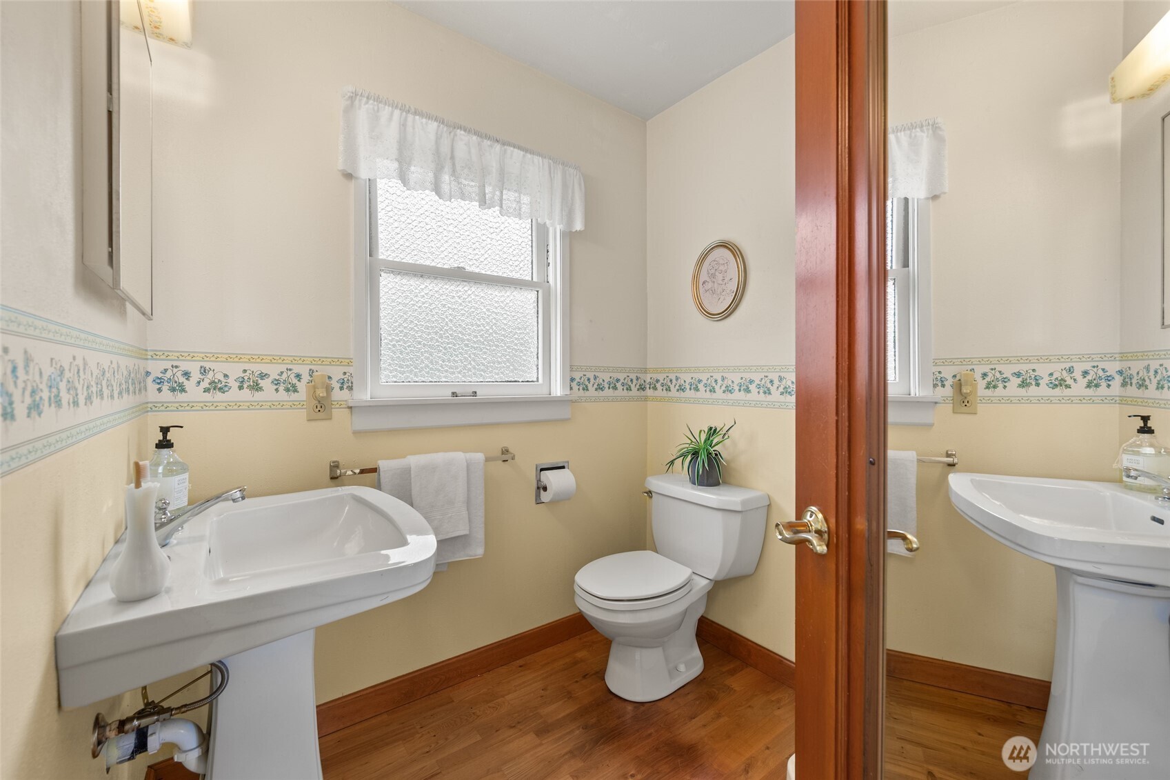 9619 Southwest 268th Street Vashon, WA 98070 - Photo 24 of 37 a bathroom with a sink a toilet and a mirror