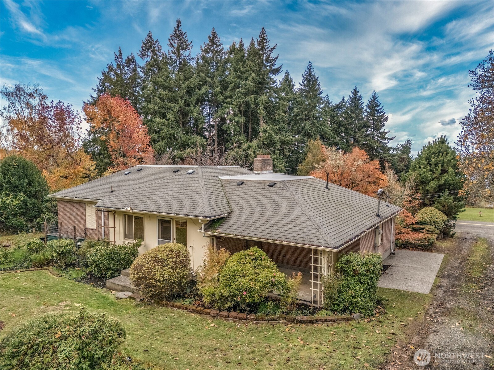 9619 Southwest 268th Street Vashon, WA 98070 - Photo 7 of 37 a aerial view of a house with table and chair
