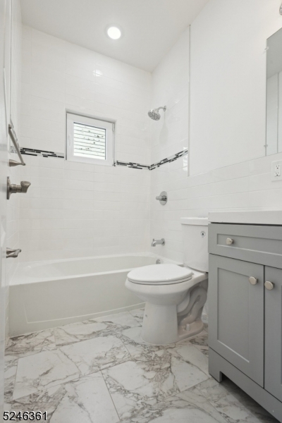 492 South 20th Street, Unit 2 Newark, NJ 07103 - Photo 4 of 12 a bathroom with a toilet a sink and bathtub