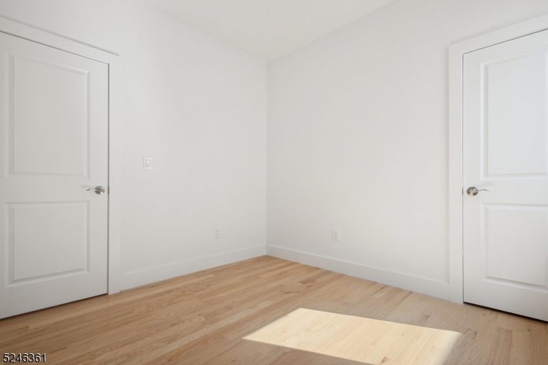 492 South 20th Street, Unit 2 Newark, NJ 07103 - Photo 6 of 12 a view of empty room with wooden floor