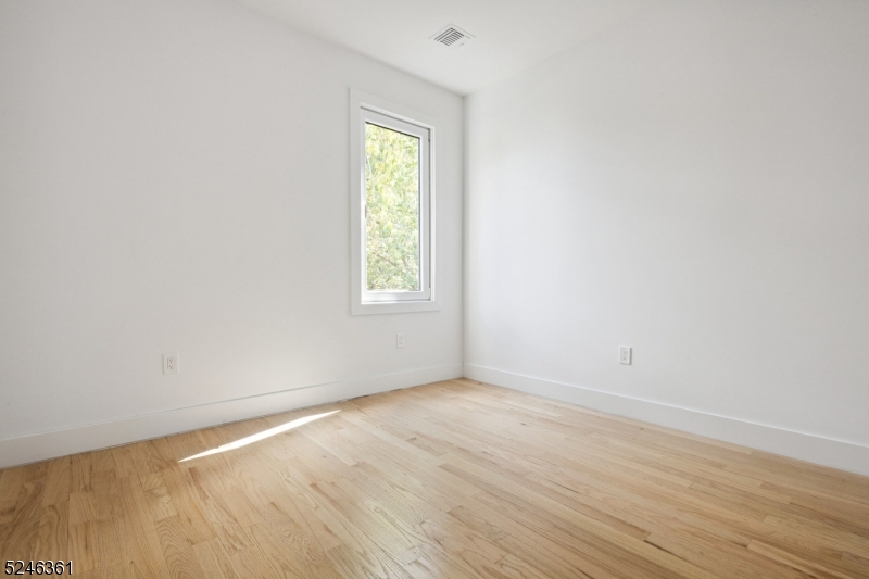 492 South 20th Street, Unit 2 Newark, NJ 07103 - Photo 7 of 12 an empty room with a window