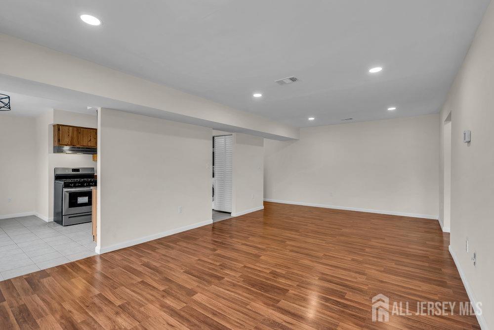 1610 Raspberry Court Edison, NJ 08817 - Photo 5 of 18 a view of empty room with wooden floor