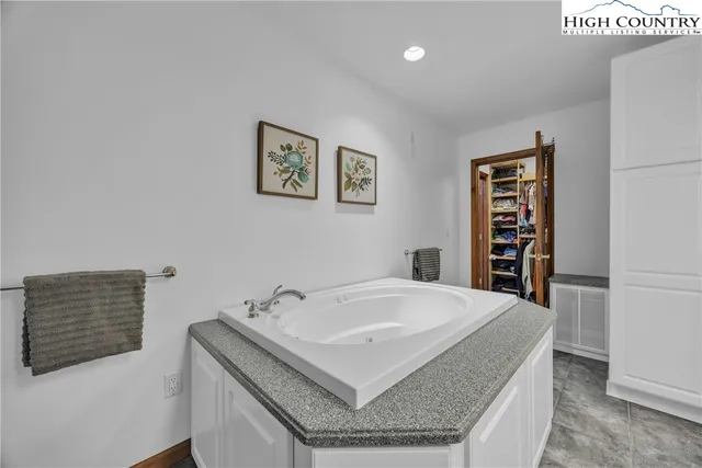 a living room with furniture hardwood floor and a window