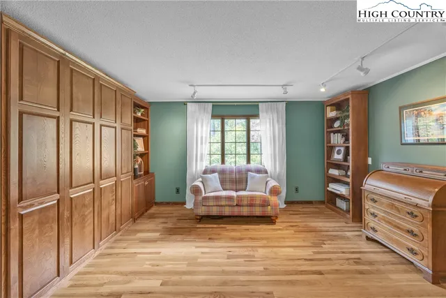 a bedroom with furniture and window