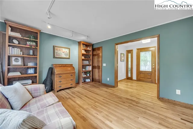 a spacious bathroom with a granite countertop sink and a large mirror