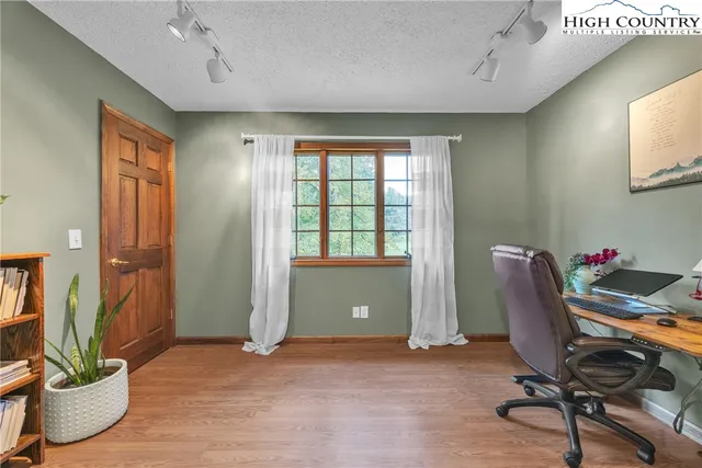 a view of a hallway with a bedroom