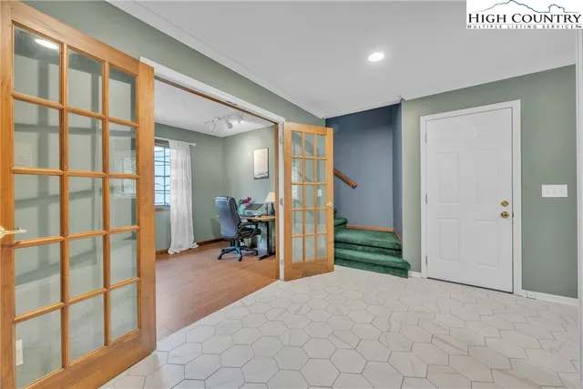 a kitchen with stainless steel appliances a stove a sink and a microwave