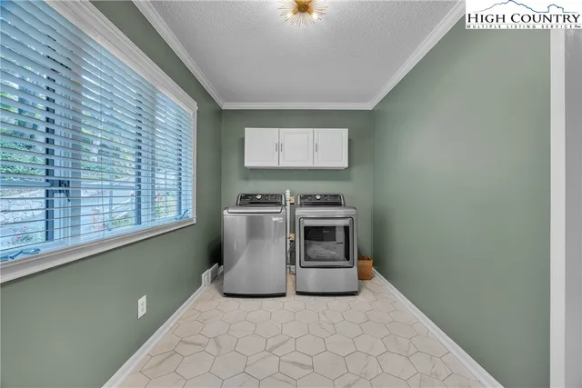 a balcony with furniture and a potted plant
