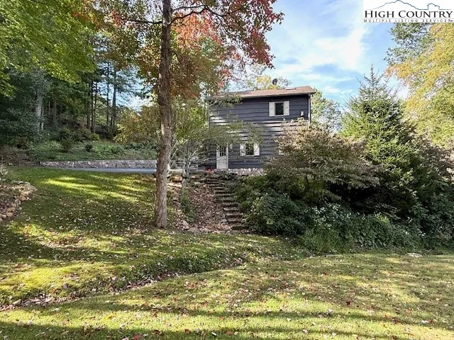 a view of a field with an trees
