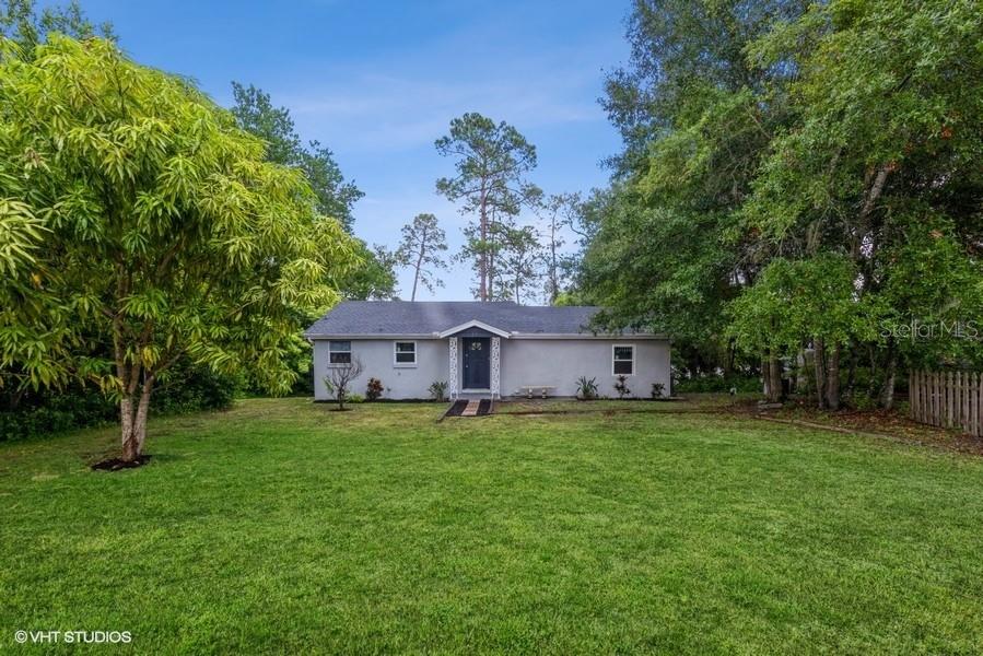 11 Naranja Road DeBary, FL 32713 - Photo 1 of 1 a house with a tree in front of it