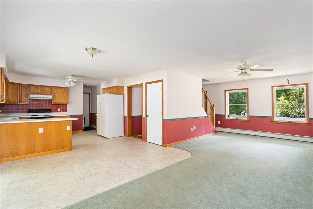 36 Depot Road Hatfield, MA 01038 - Photo 16 of 39 a view of an empty room with window and kitchen view