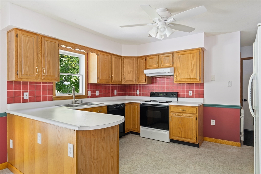 36 Depot Road Hatfield, MA 01038 - Photo 18 of 39 a kitchen with stainless steel appliances granite countertop a sink a stove and a refrigerator