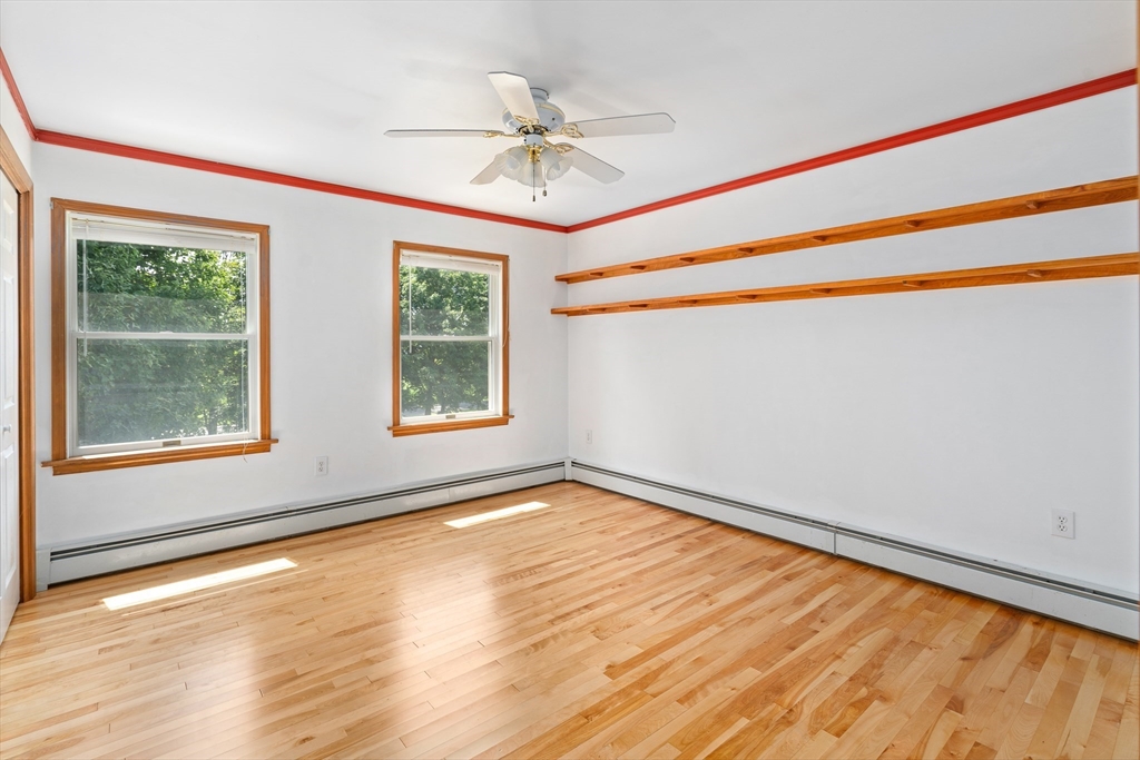 36 Depot Road Hatfield, MA 01038 - Photo 26 of 39 a view of an empty room with a window and wooden floor