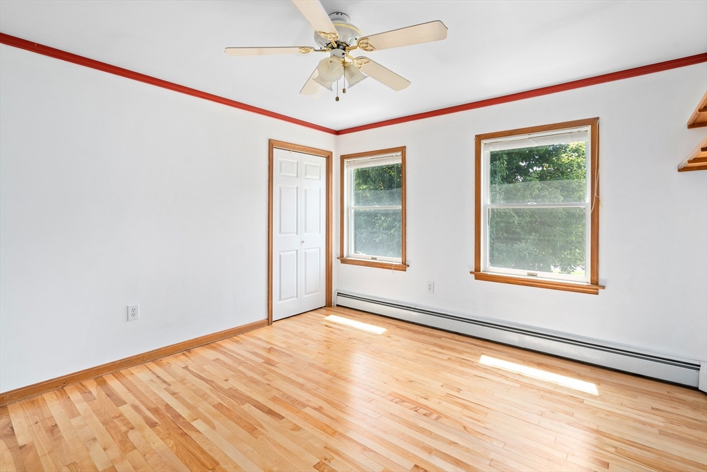 36 Depot Road Hatfield, MA 01038 - Photo 27 of 39 a view of an empty room with a window and wooden floor