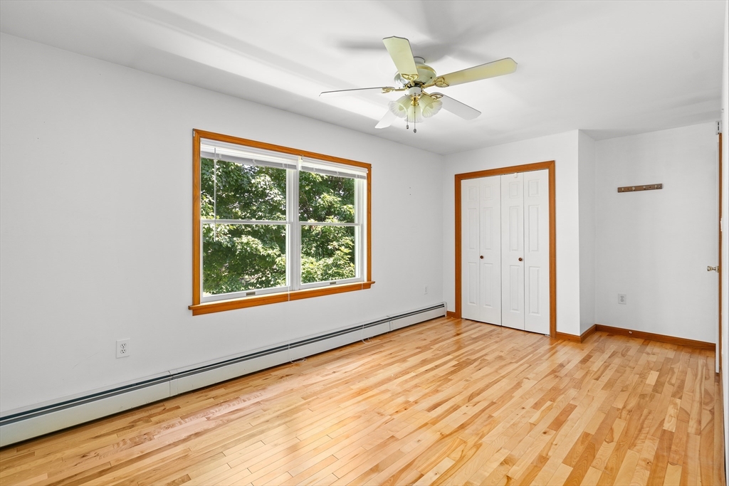 36 Depot Road Hatfield, MA 01038 - Photo 29 of 39 a view of an empty room with wooden floor and a window